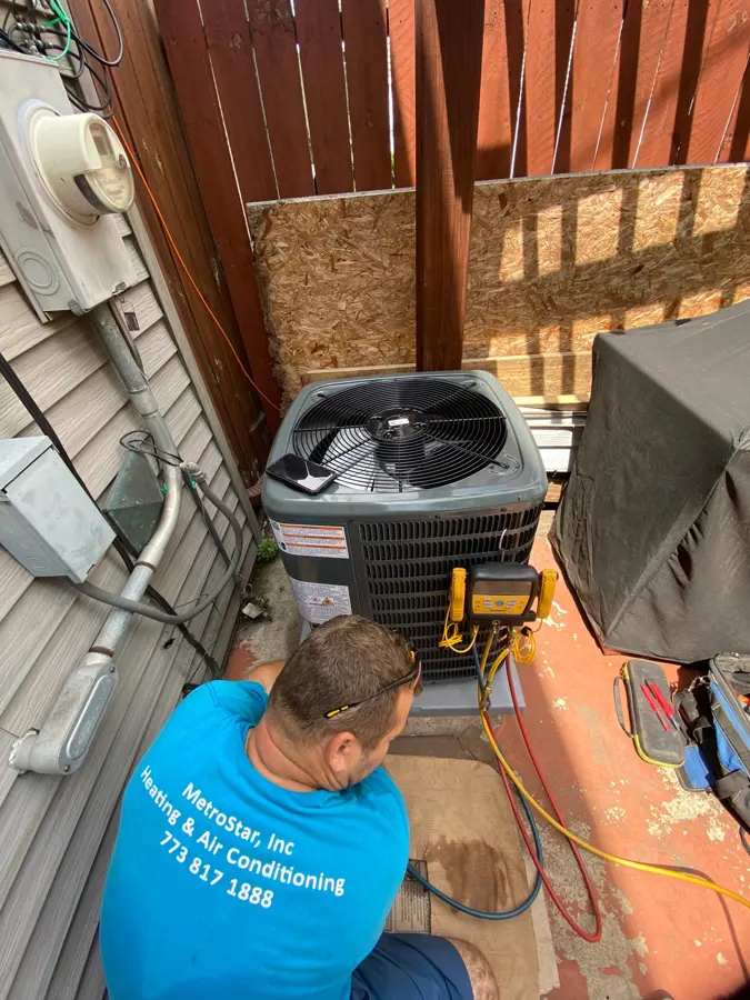 Peter servicing an outdoor AC condenser